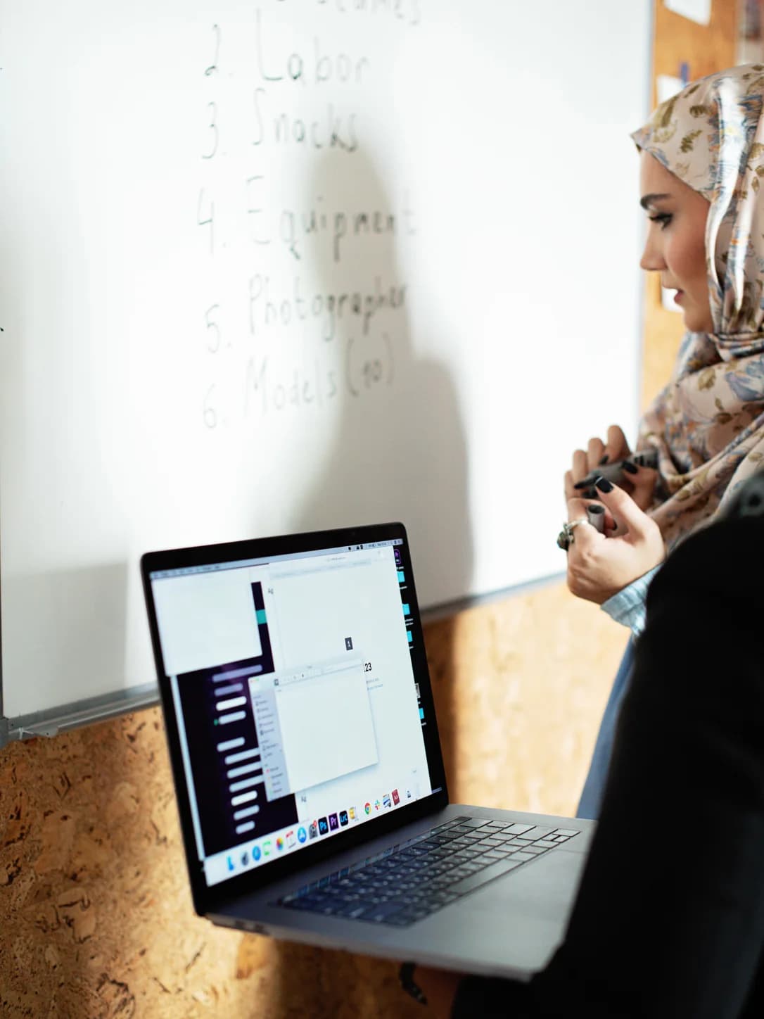 Technical leadership archetype speaking beside a whiteboard during a working session